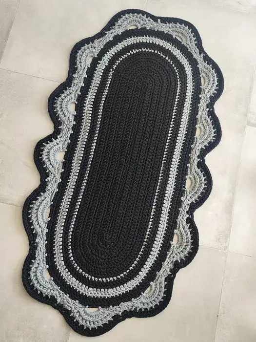 שטיח אליפסה שחור עם עיטורים אפורים